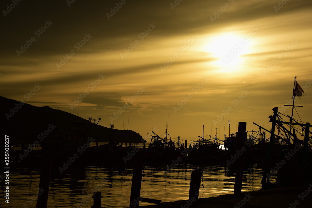 Fishing port view before sunset With beautiful golden yellow sky