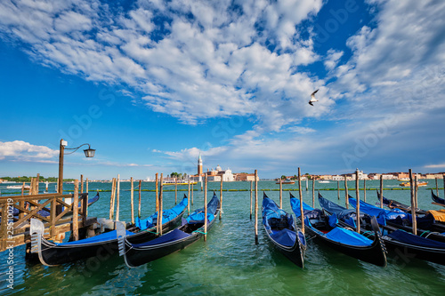 Gondolas and in lagoon of Venice by San Marco square. Venice, Italy © Dmitry Rukhlenko