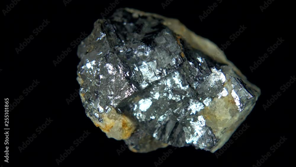 Seamlessly rotating a metallic mineral (Galena) in front of black background Seamlessly rotating a metallic mineral (Galena) in front of black background