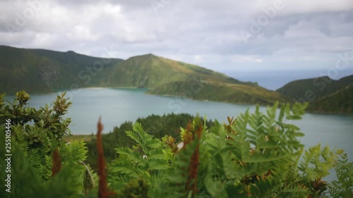 view of a mountain lake in the crater of an extinct volcano of thick green