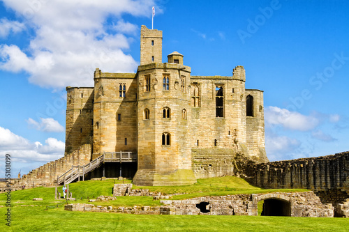 WARKWORTH, UNITED KINGDOM - APRIL 30, 2018: The view from outside the property of Warkworth Castle, a ruined medieval building in the village of the same name in the English county of Northumberland photo