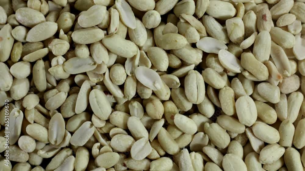 A lot of peeled peanut stop motion. Top view. Background A lot of peeled peanut stop motion. Top view. Background