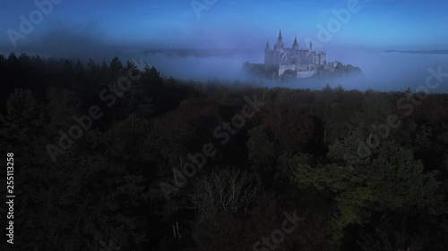 Aerial shot – Fantasy Castle in a foggy forest at night