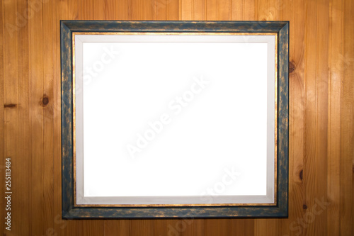 White isolated clipping path template on old picture frame on vintage wood wall