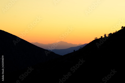 idyllic symmetry scenery landscape of soft orange sunset in mountain highland environment picturesque background wallpaper pattern with empty copy space for your text or inscription