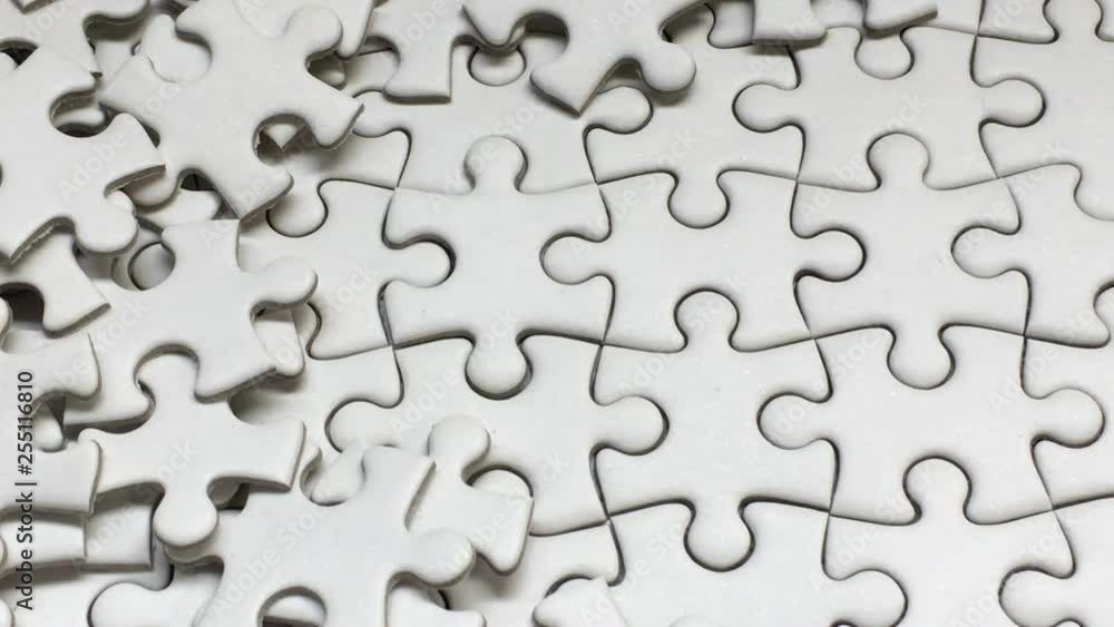 White Jigsaw Puzzle piece put into missing places with white background, Succeed in Business concept, Debt settlement concept. White Jigsaw Puzzle piece put into missing places with white background, Succeed in Business concept, Debt settlement concept.