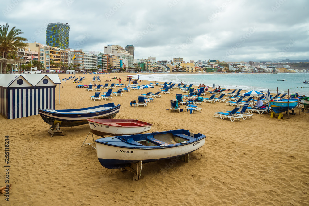 Tourism and travel. Windy day on the ocean. Canary Islands, Gran Canaria, Atlantic Ocean. Tropics. Sandy beach in the city of Las Palmas