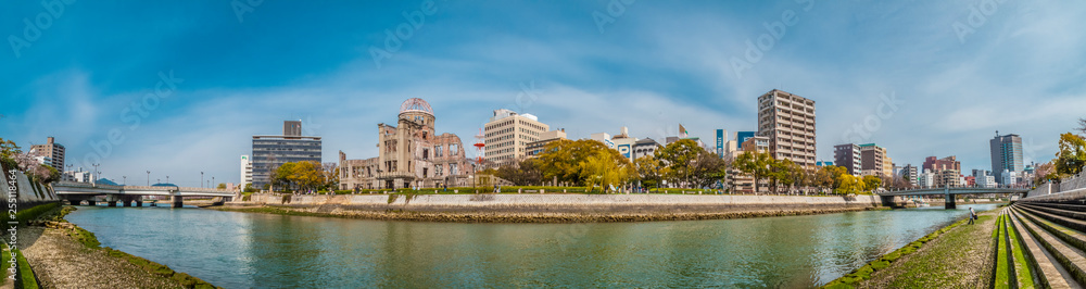 Panorama of the Hiroshima Peace Memorial Dome, Hiroshima, Japan, seen from the western bank of the Motoyasu River.