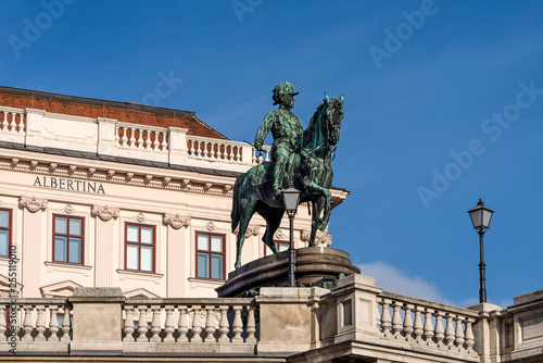 Austria, Vienna, Albrechtsplatz: Front view of world famous Albertina museum palais palace with Albrecht statue in the city center of the Austrian capital with blue sky - concept travel history art