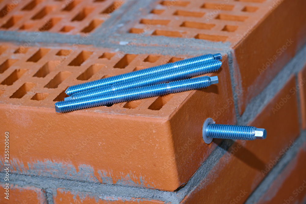 set of parts for mounting anchors in hollow brick and concrete lie on