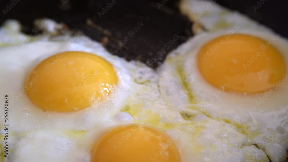 Egg fried in a pan. Traditional breakfast eggs. 4K Egg fried in a pan. Traditional breakfast eggs. 4K