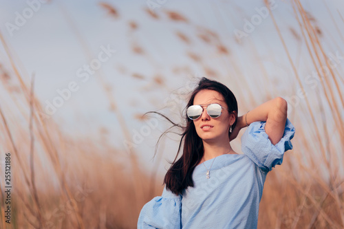 Woman Wearing Mirror Sunglasses in Outdoor Fashion Portrait