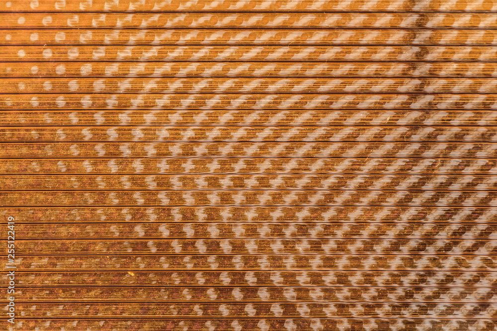 A beautiful horizontal texture of the yellow Polycarbonate Sheet with sun glares A beautiful horizontal texture of the yellow Polycarbonate Sheet with sun glares