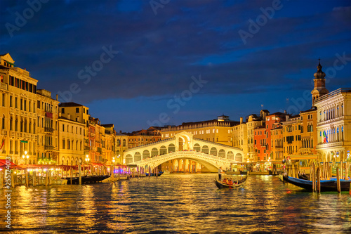 Rialto bridge Ponte di Rialto over Grand Canal at night in Venice, Italy