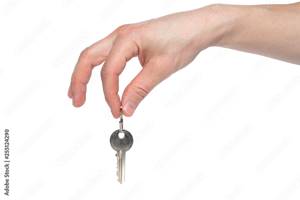 Human hand holding house key isolated on white background. Concept of new life and new home Human hand holding house key isolated on white background. Concept of new life and new home