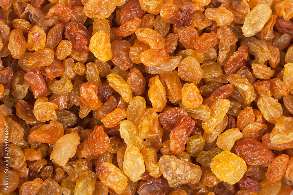Delicious yellow raisins, highest grade. Delicious and beautiful background or wallpaper, top view Delicious yellow raisins, highest grade. Delicious and beautiful background or wallpaper, top view