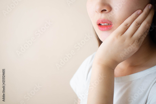 Bild auf Leinwand Young woman suffering from toothache over white background