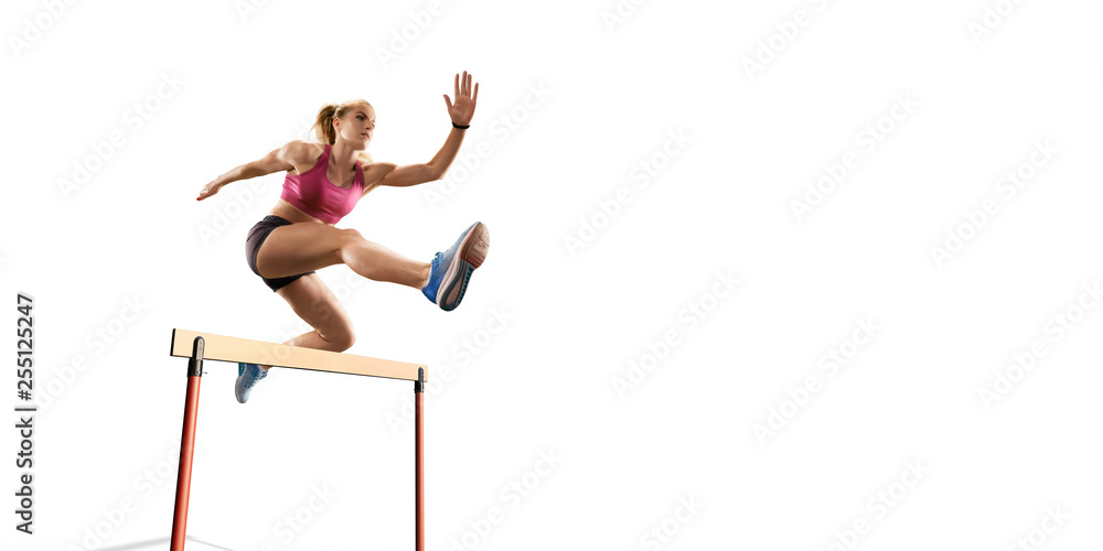 Isolated Female Track and field athlete jumps over the barrier on white ...