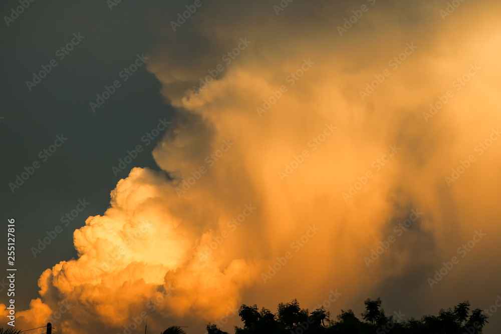 huge heap giant orange sunset cloud dark sky