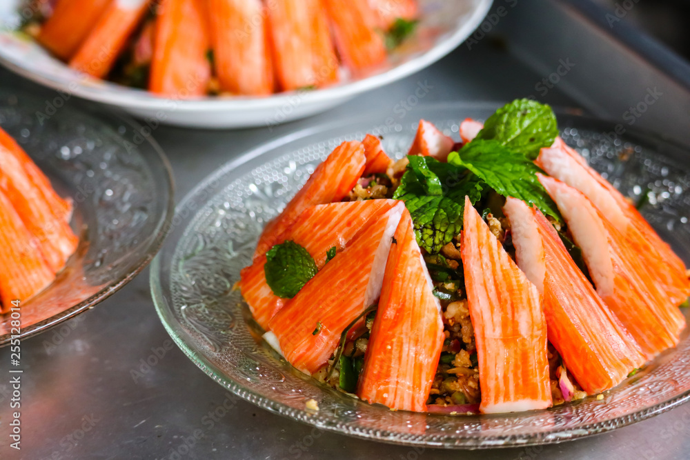 spicy minced crab sticks salad and mint leaves on top spicy minced crab sticks salad and mint leaves on top