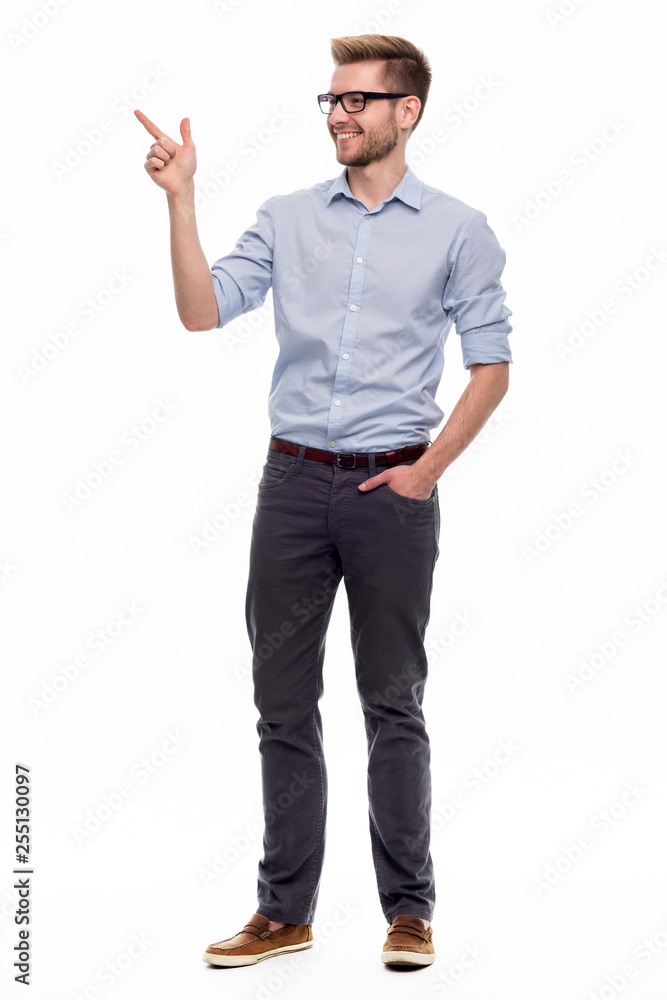 Full length portrait of young man pointing Full length portrait of young man pointing
