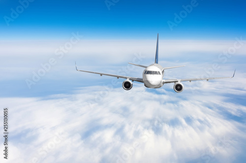 Modern airplane mith motion blur effect travel at sunny bright day