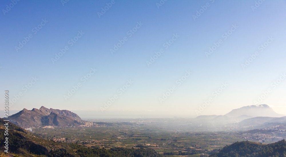 Panoramic view of Rectoria Valley in Marina Alta region, Alicante, Spain. View from Vall de Laguar town. Segaria and Montgó mountains are in the background.