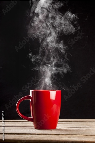 Red hot cup of coffee on black