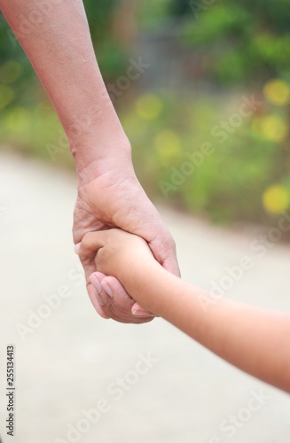 Family support - father hold child hand with love © banprik