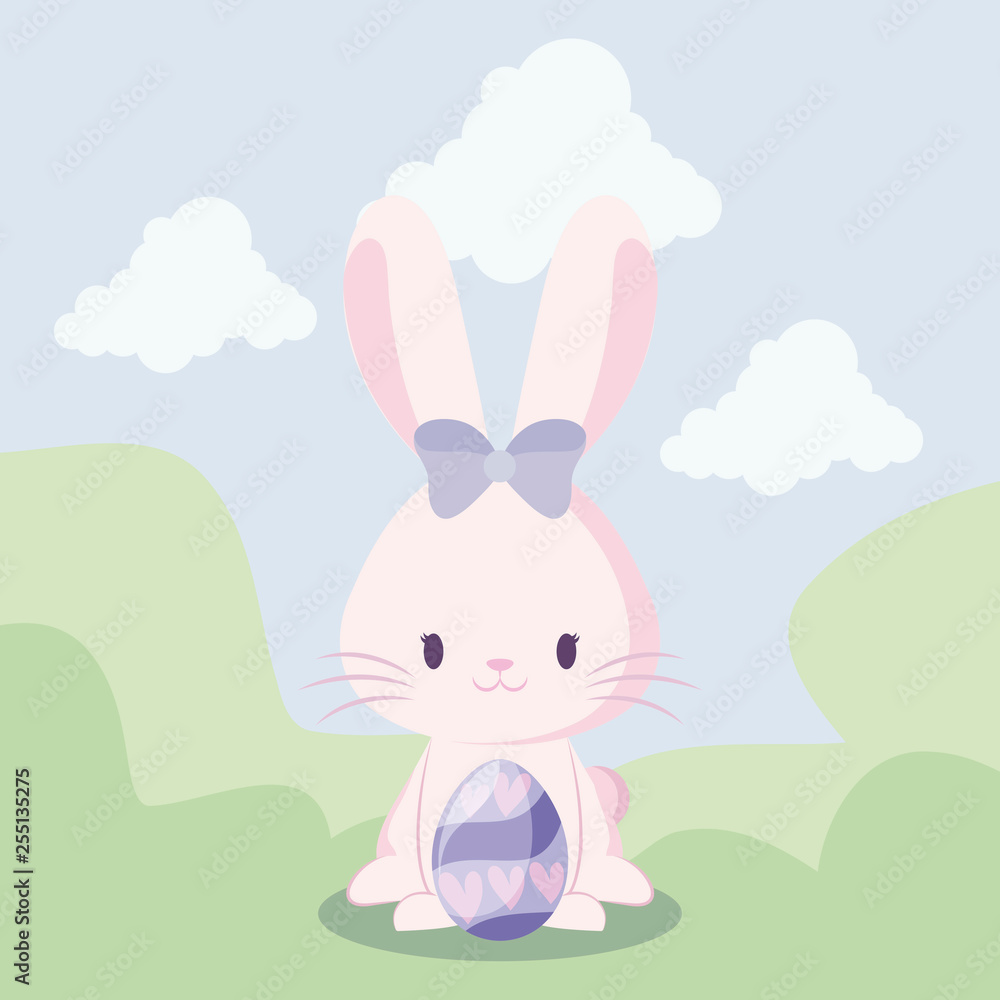 cute rabbit female with egg of easter in landscape cute rabbit female with egg of easter in landscape