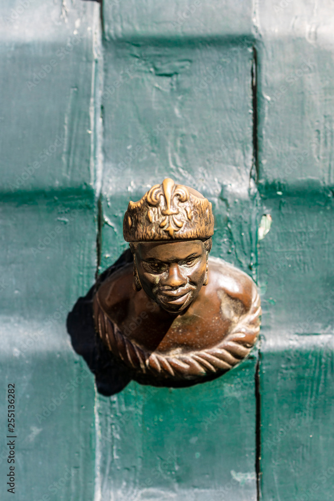 Ornament on a green door in Venice