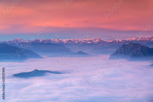 Iseo lake under the fog in Autumn season at sunset, Lombardy district, Brescia province, Italy, Europe photo