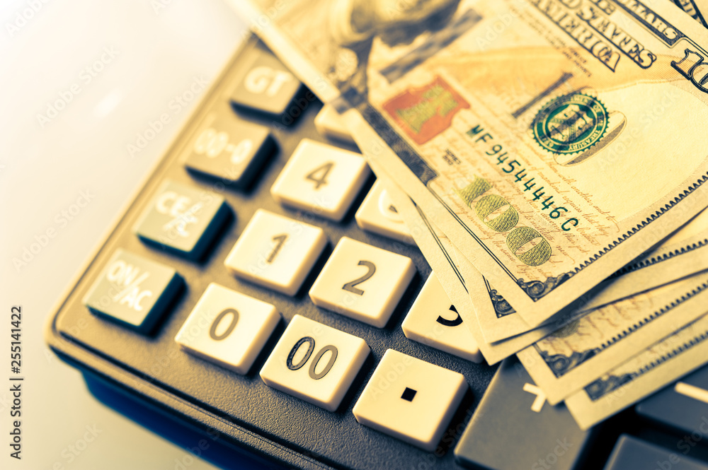 Business and financial background with dollars and calculator. Bookkeeping background. Business and financial background with dollars and calculator. Bookkeeping background.