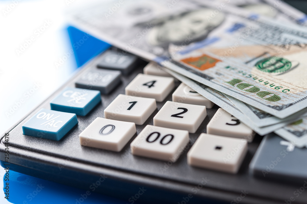 Business and financial background with dollars and calculator. Bookkeeping background. Business and financial background with dollars and calculator. Bookkeeping background.