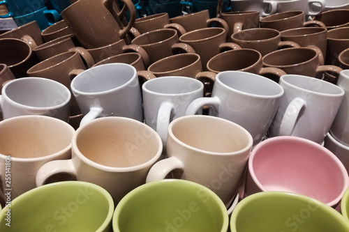 Set of many empty cups different colors abstract background