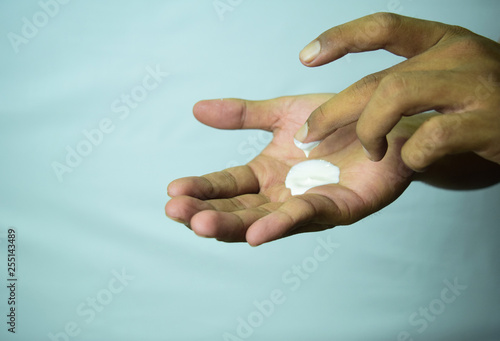 Applying moisturizing cream on hands. Skin care 