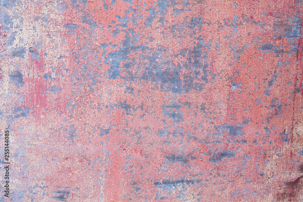 Old distressed red painted sheet iron wall grungy background or texture