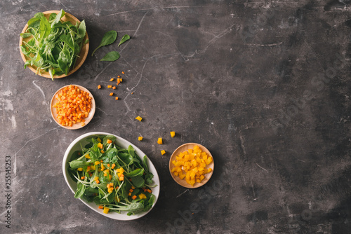 Fresh organic micro greens with carrot diced, food closeup