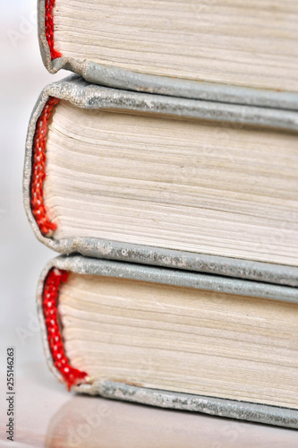 Stack old books in a light cover photo