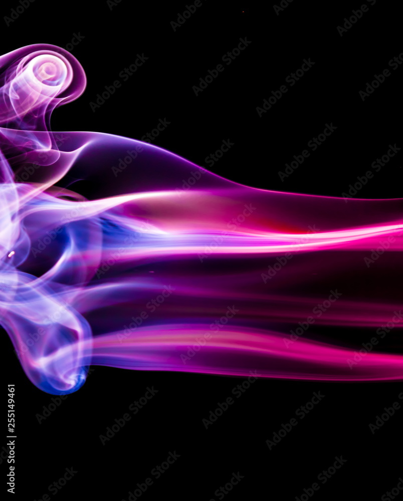 Fototapeta premium Colored smoke on black background