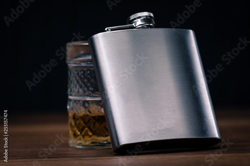 hip flask on black background photo