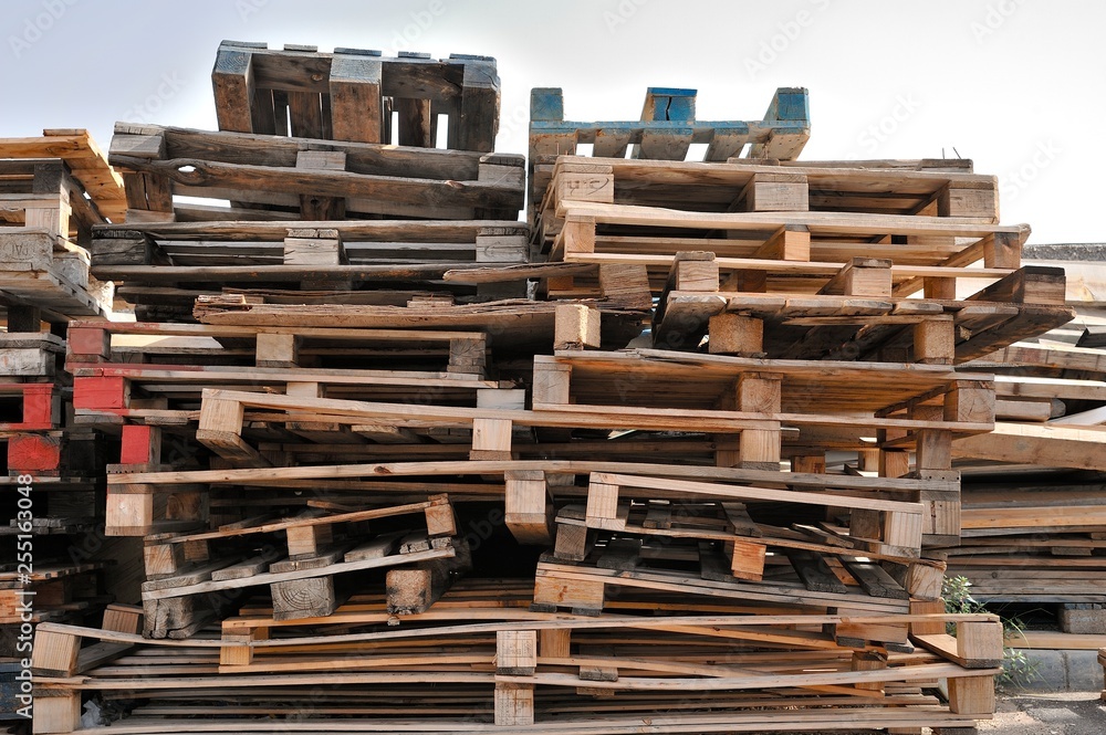Stacked wooden pallets. Stacked wooden pallets.