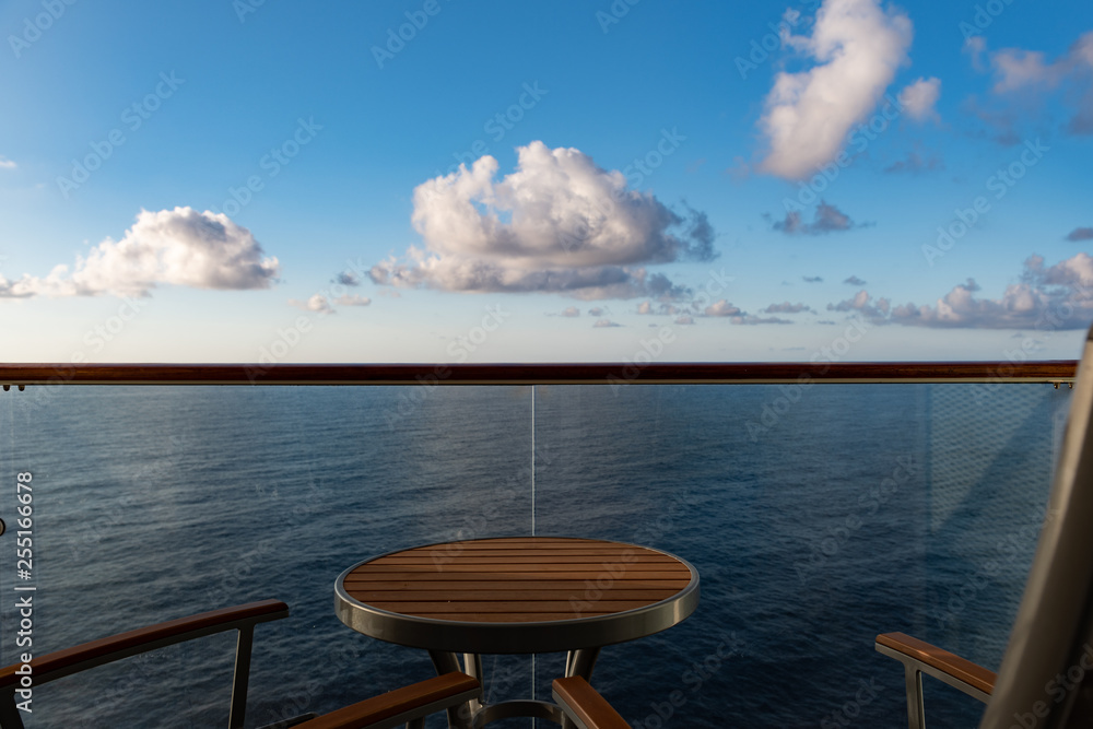 Private veranda on a cruise ship overlooking the ocean with copy space
