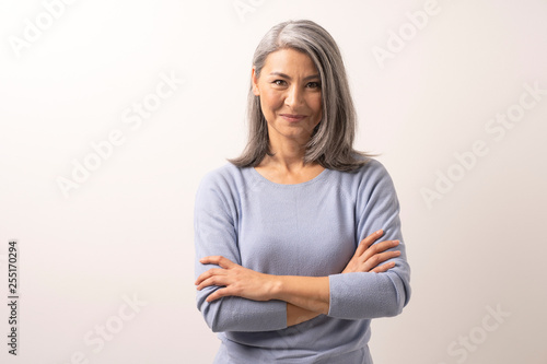 Fotografie, Obraz Beautiful grey-haired woman with crossed arms