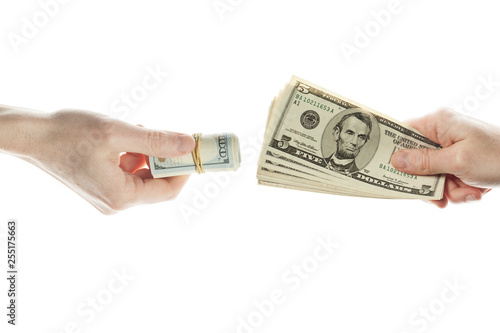 US dollars cash money in giving hand and taking hand isolated on white