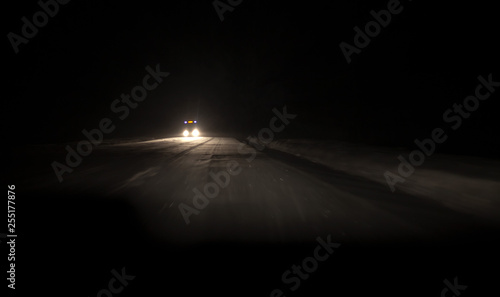 dark blurred background kind of night roads of the highway. headlights of oncoming cars
