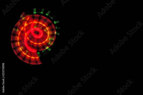 black background and light abstract patterns rainbow colorful, copy space, menu, freezelight drawing colored light © Lyubov Furs