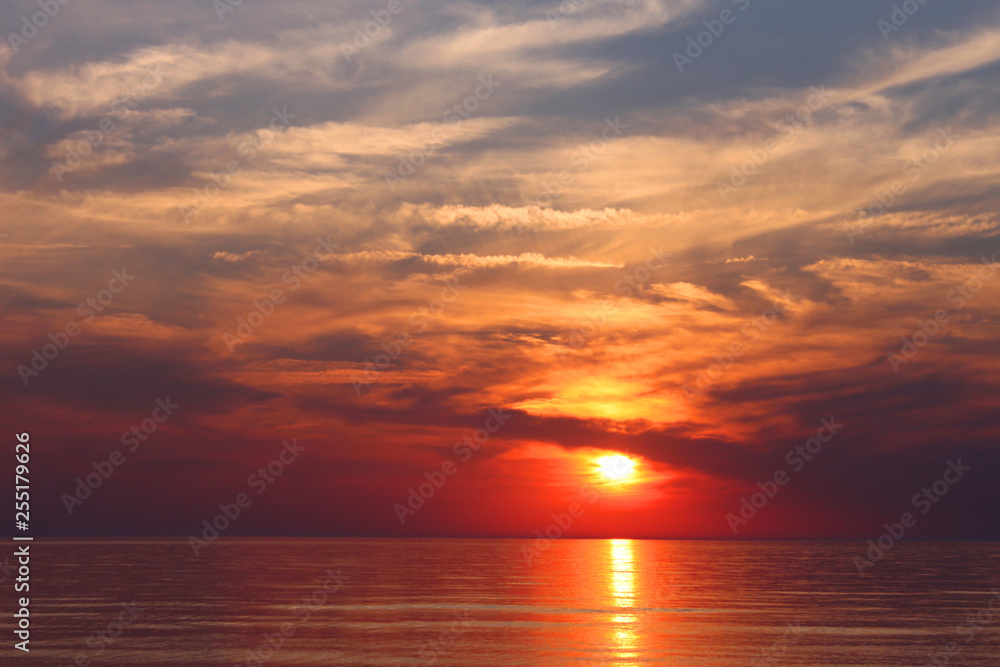 Bright red background of sea sunset, vacation concept, travel