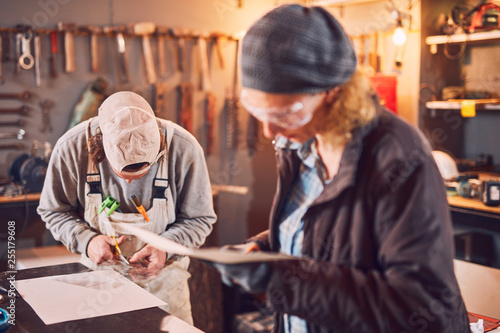 Couple working together in a retro vintage garage.