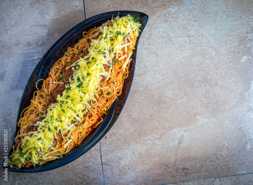 Tasty appetising classic i spaghetti pasta with tomato sauce, cheesey photo